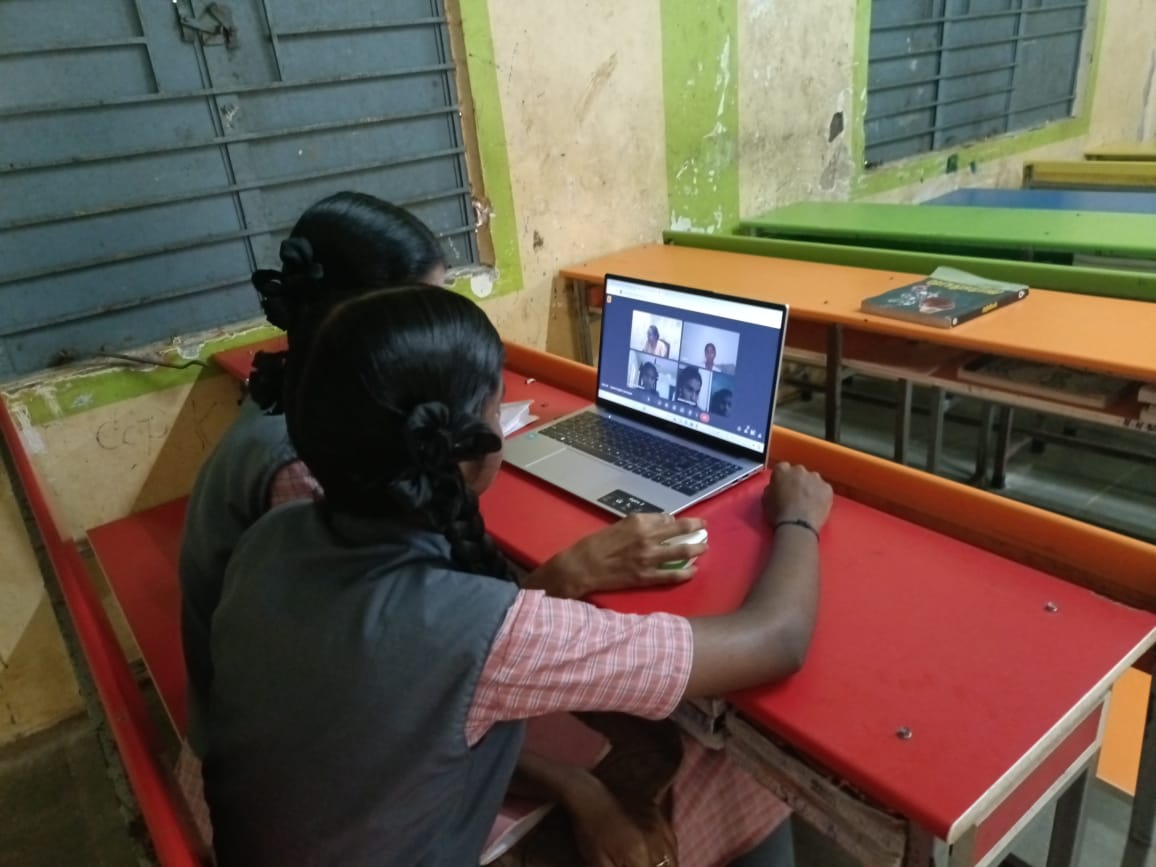 Students using laptops for peer-to-peer learning via video call